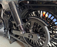 LawlessCC gloss black swing arm installed on a Harley Softail motorcycle with custom rear suspension