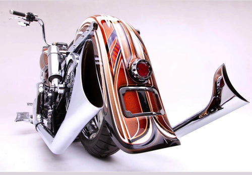 Rear view of a Harley-Davidson Softail featuring the El Jefe upsweep exhaust with chrome fishtail tips. Available exclusively thru Lawless Custom Cycles