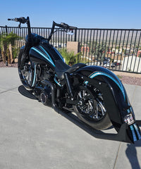 Custom Harley Softail featuring the LawlessCC hand-built swing arm with integrated air tank.