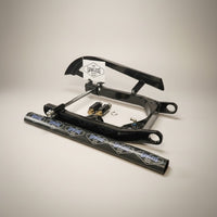 LawlessCC Harley swing arm kit showing integrated air tank, belt guard, upper shock mounts, axle and axle adjusters.