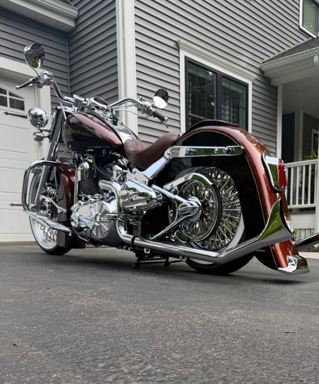 Harley Softail equipped with a LawlessCC hand-built center stand., installed with arm on the right
