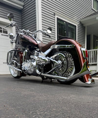 Harley Softail equipped with a LawlessCC hand-built center stand., installed with arm on the right