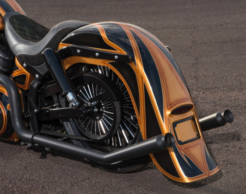 Side view showing black trumpet upswept exhaust routing for improved ground clearance. Available exclusively thru Lawless Custom Cycles